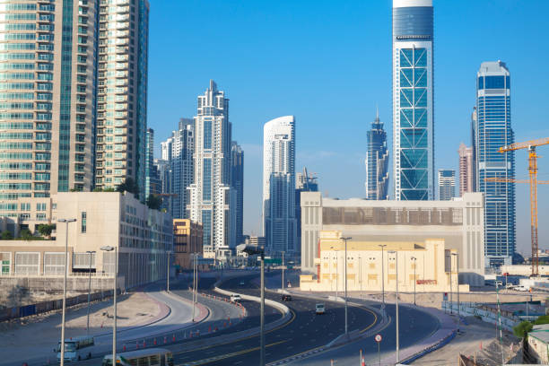 Modern Dubai skyline with high-rise buildings and a highway, highlighting the urban real estate market.