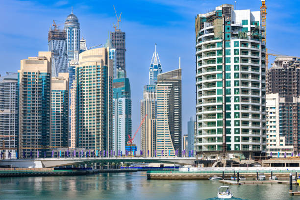 Skyscrapers and modern buildings along the Dubai Marina, showcasing urban property management challenges.